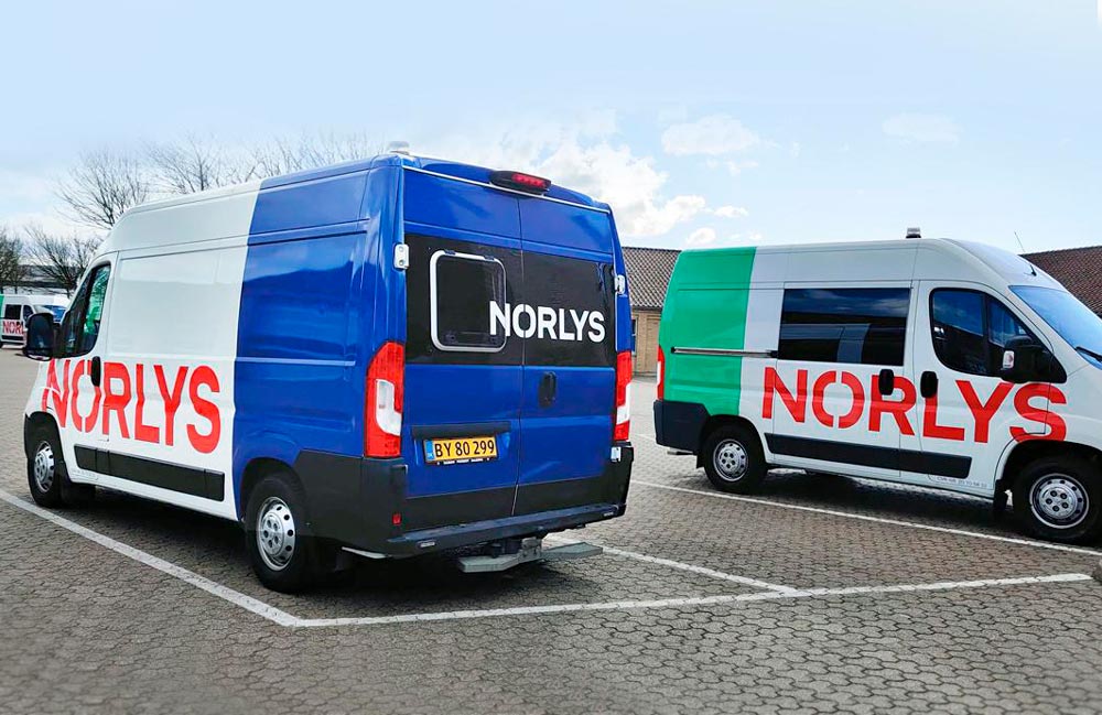 Bildekorationer på Norlys' varevogne - Nonbye a/s